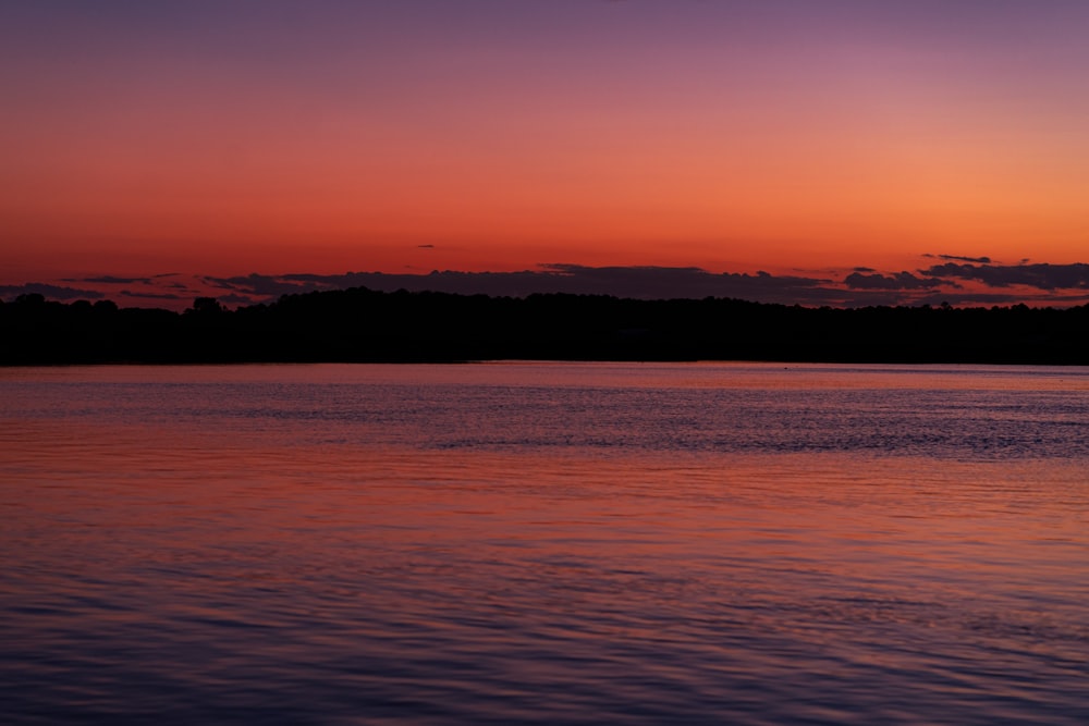 a sunset over a lake