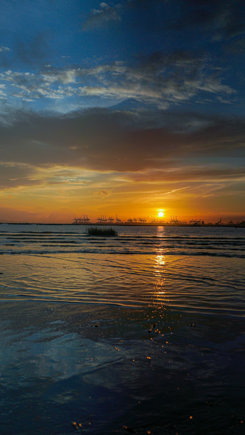 a sunset over a body of water