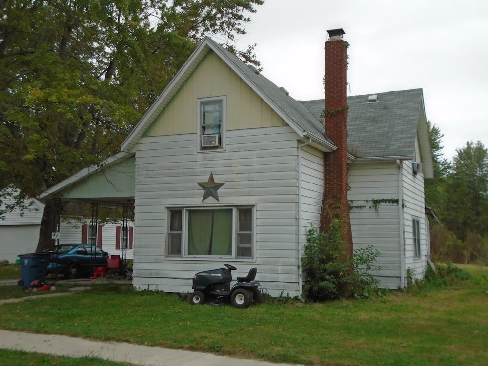 a house with a moped parked in front of it