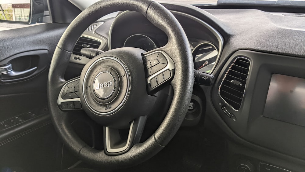 the steering wheel and dashboard of a car