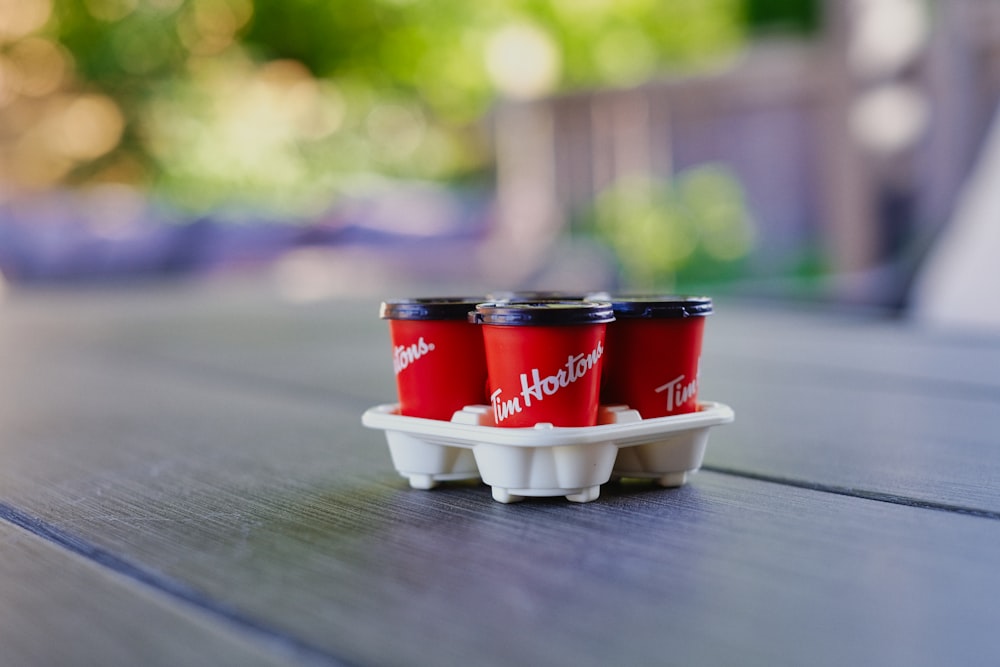 a group of red and white cans