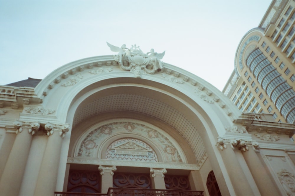 a building with a statue on top