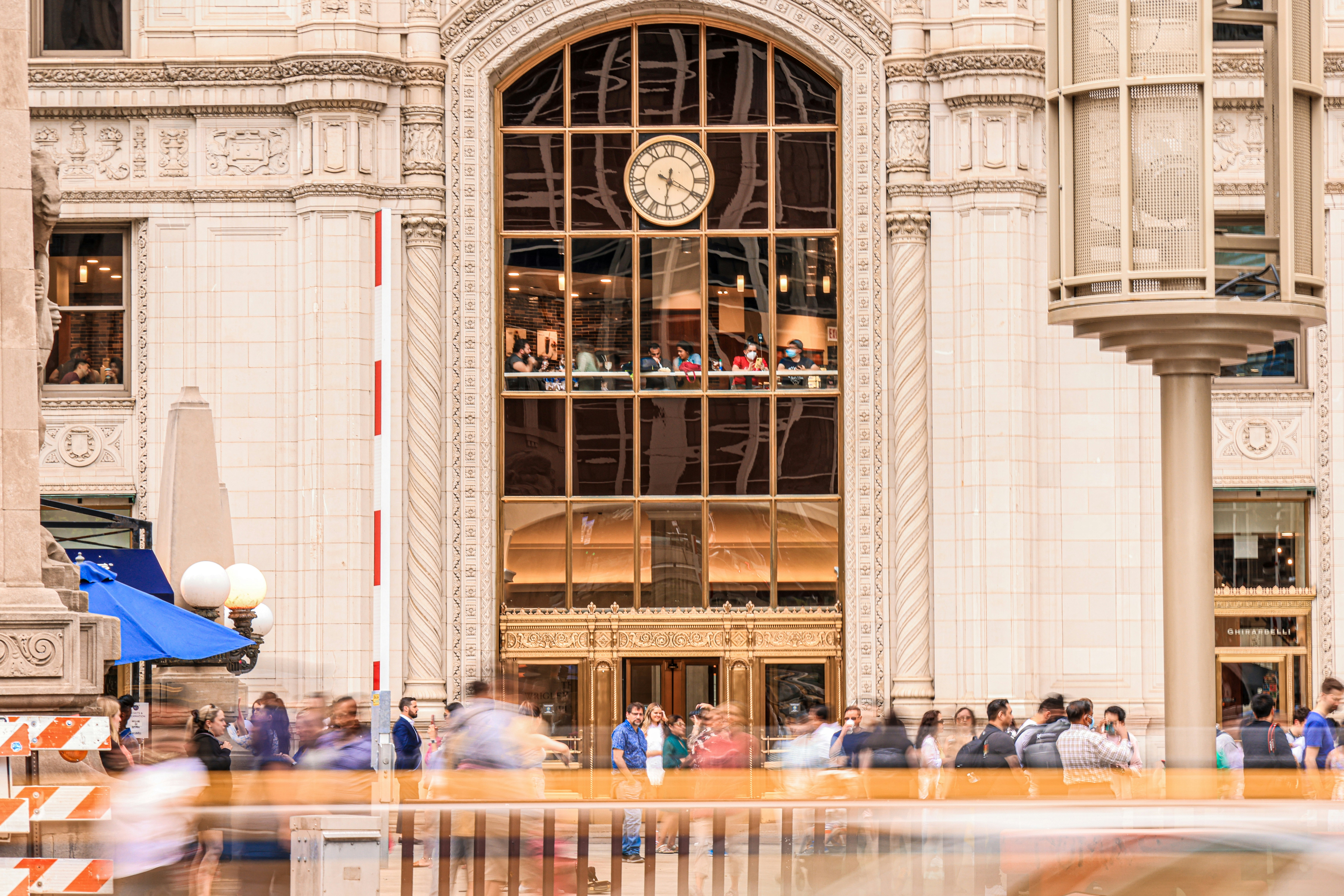 a group of people sitting outside a building