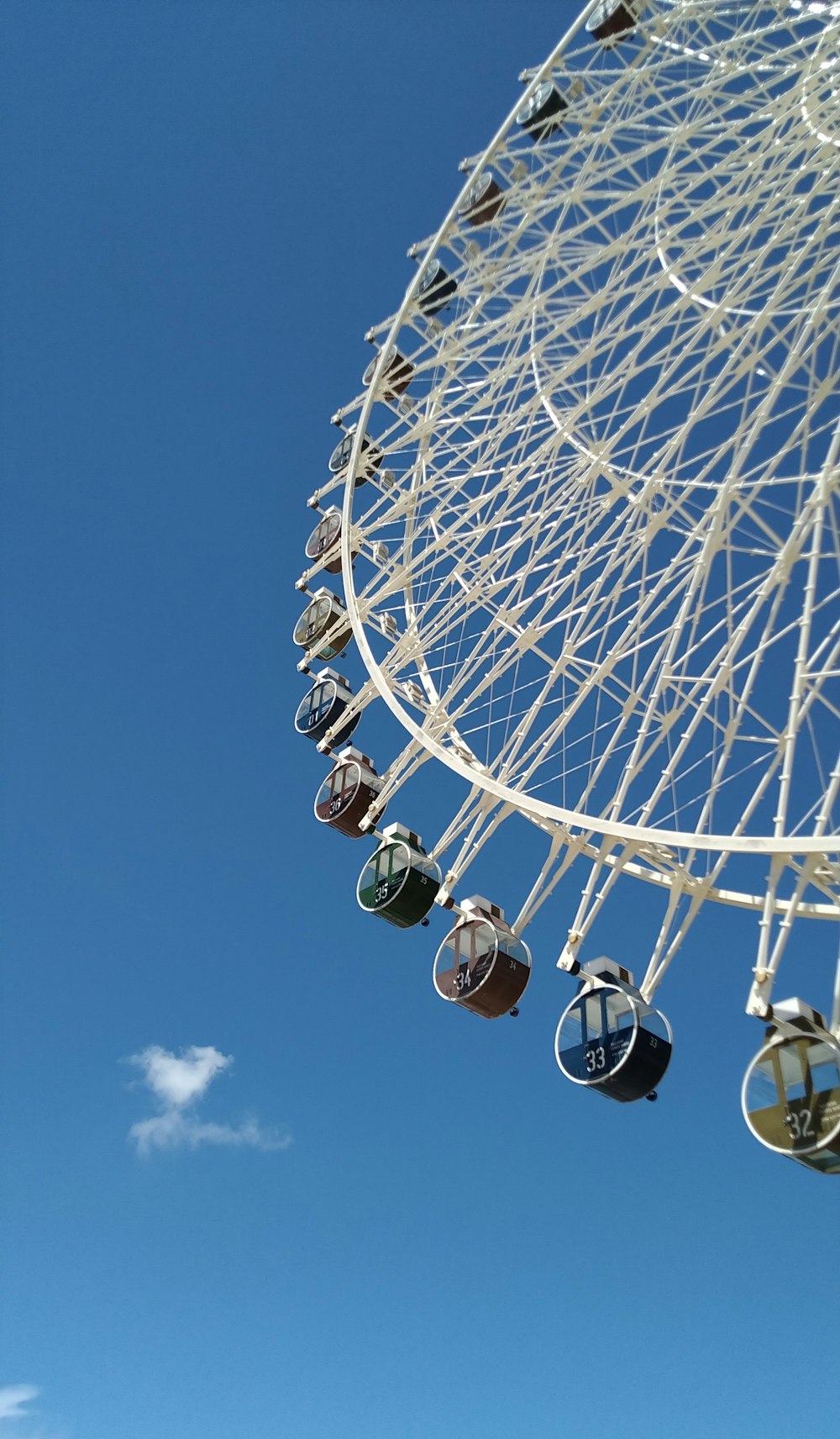 a ferris wheel against a blue sky