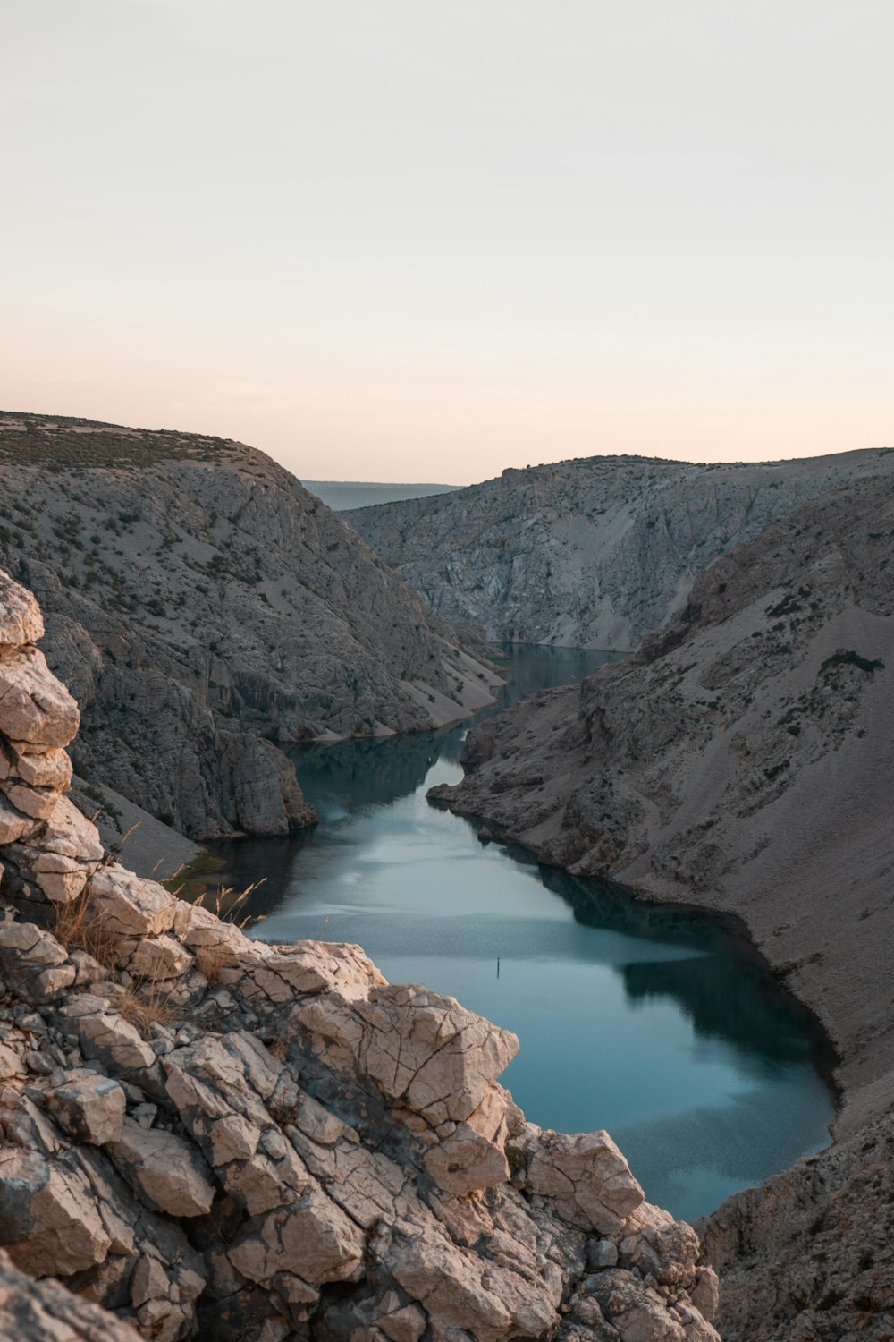 a body of water surrounded by mountains