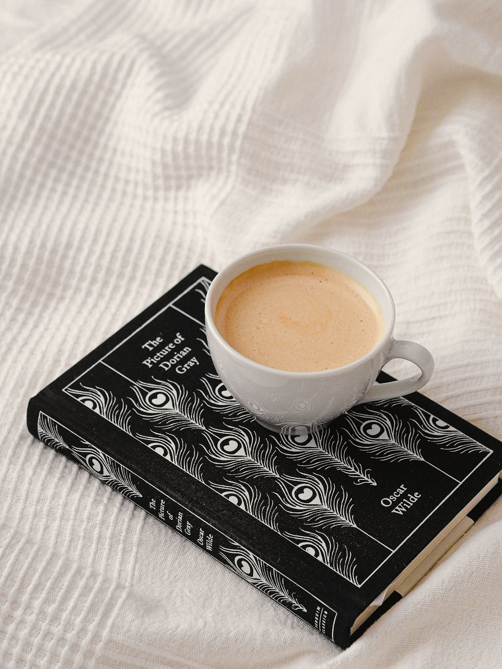 a cup of coffee on a book