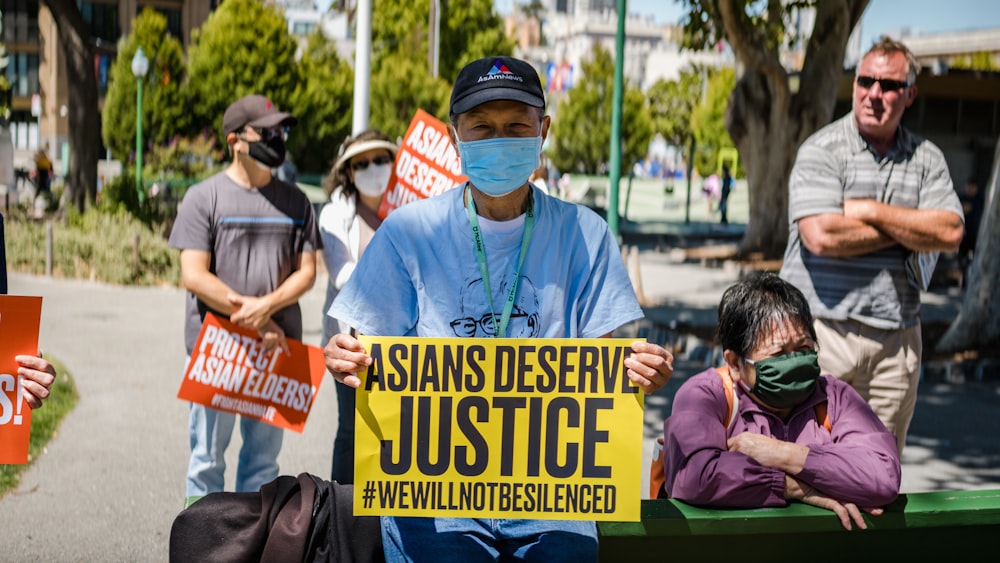 a man holding a sign