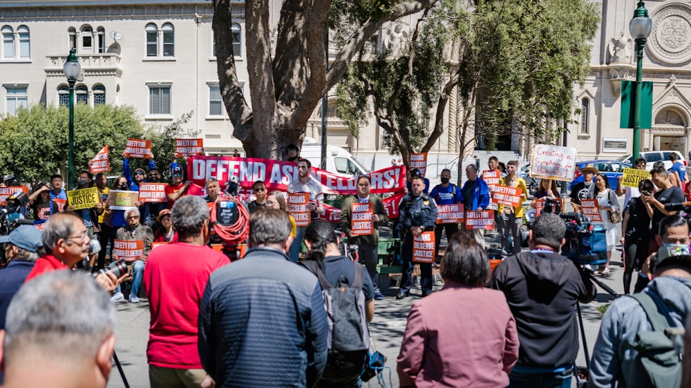 a large crowd of people marching