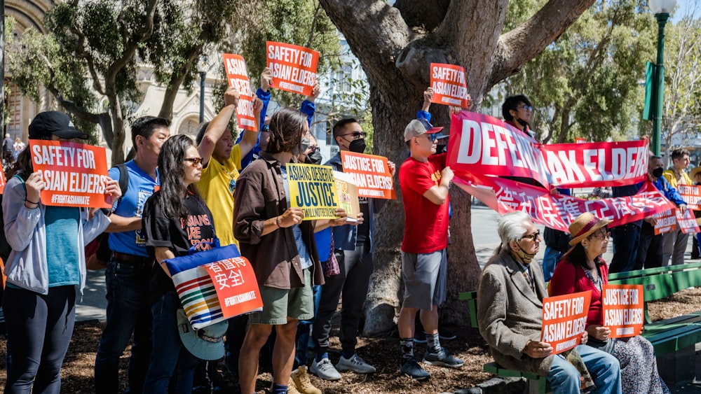 a group of people holding signs