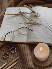 a candle and glasses on a table