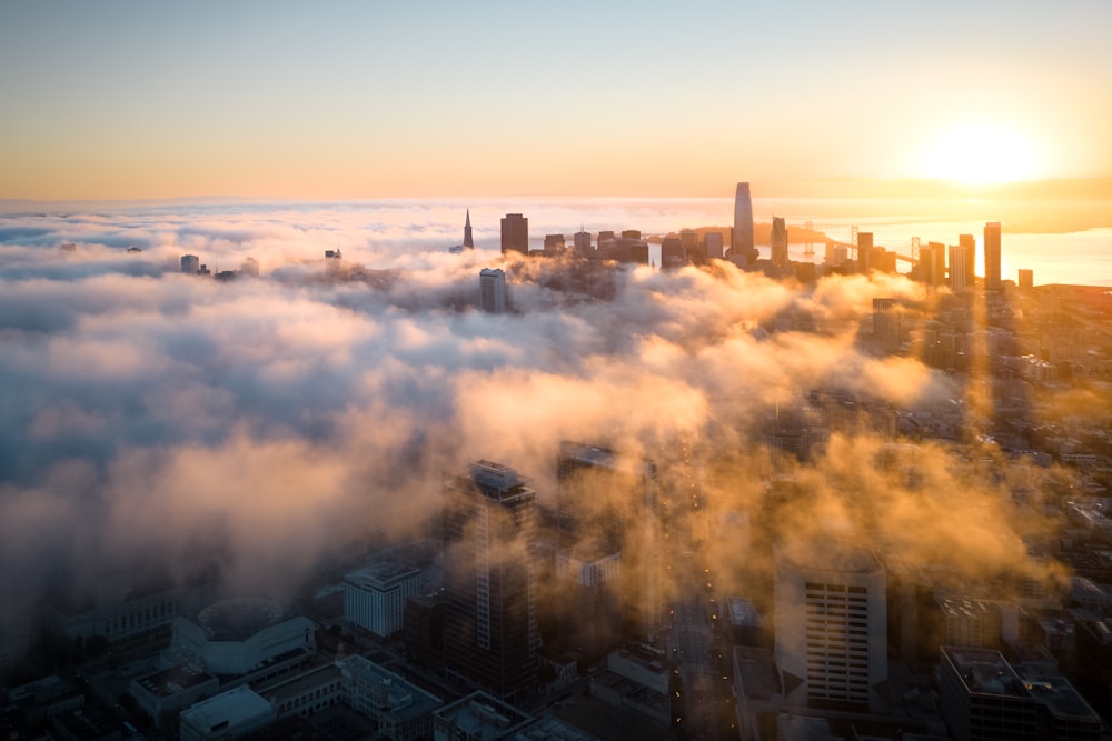 a city with many buildings and a sunset