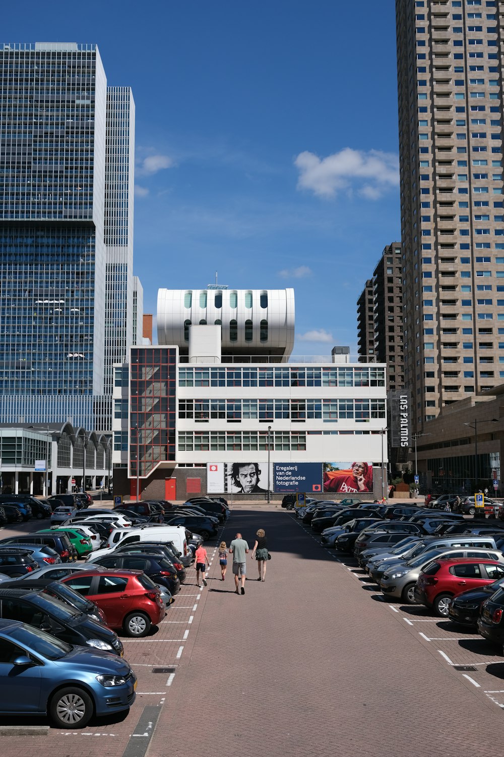 a parking lot with cars and buildings