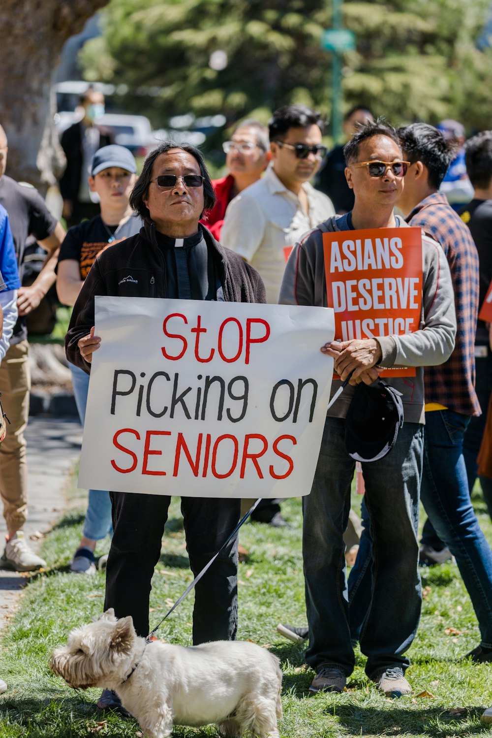 a group of people holding a sign