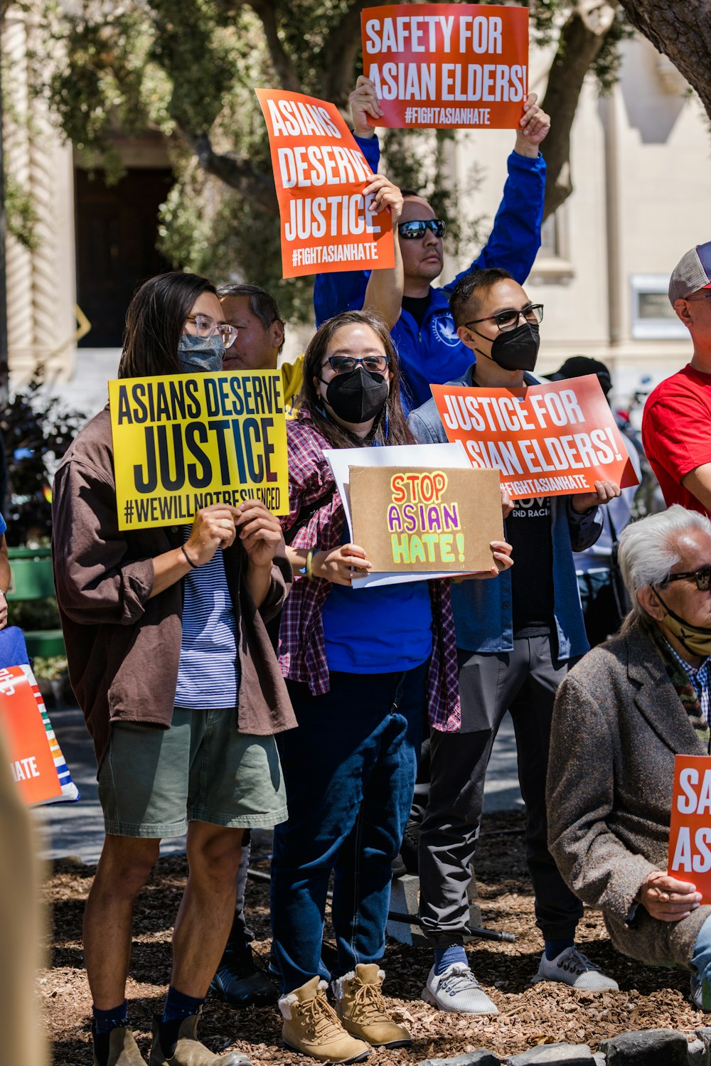 a group of people holding signs