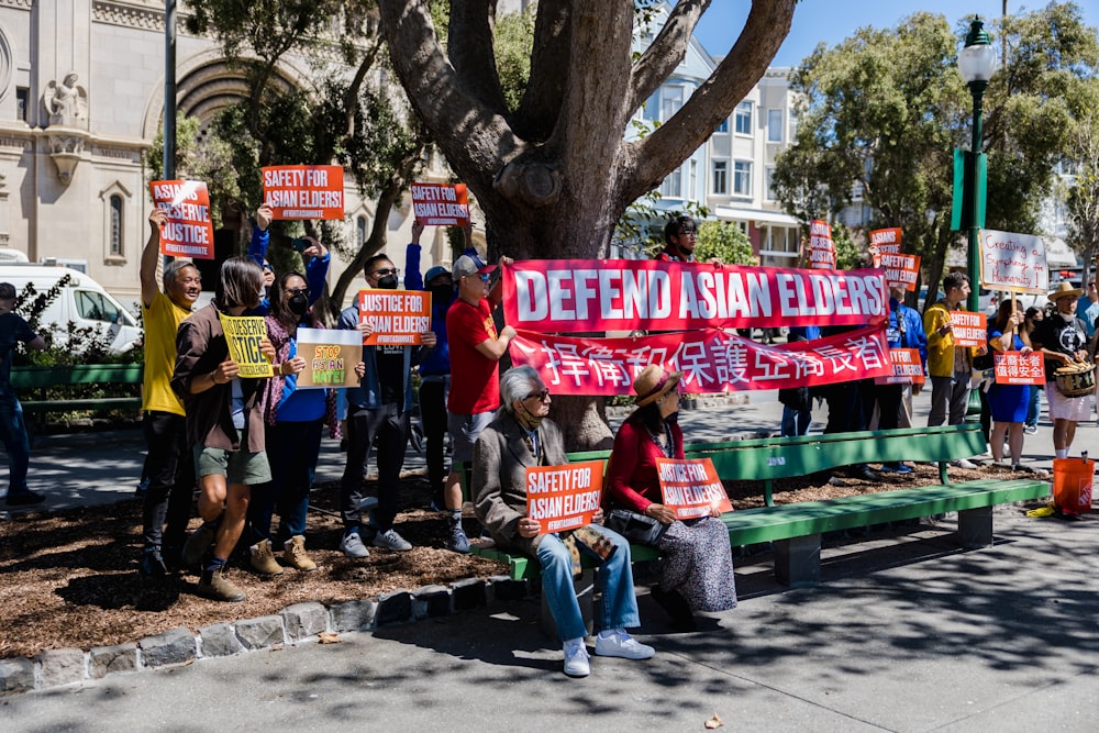 a group of people holding signs