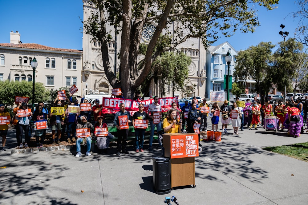 a group of people holding signs