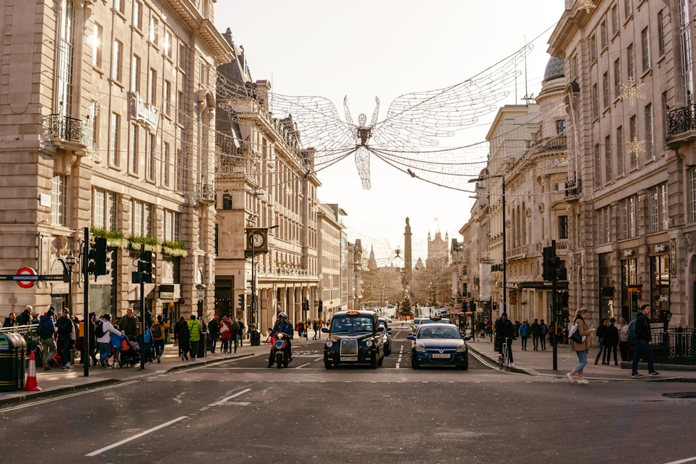 a busy street with cars and people