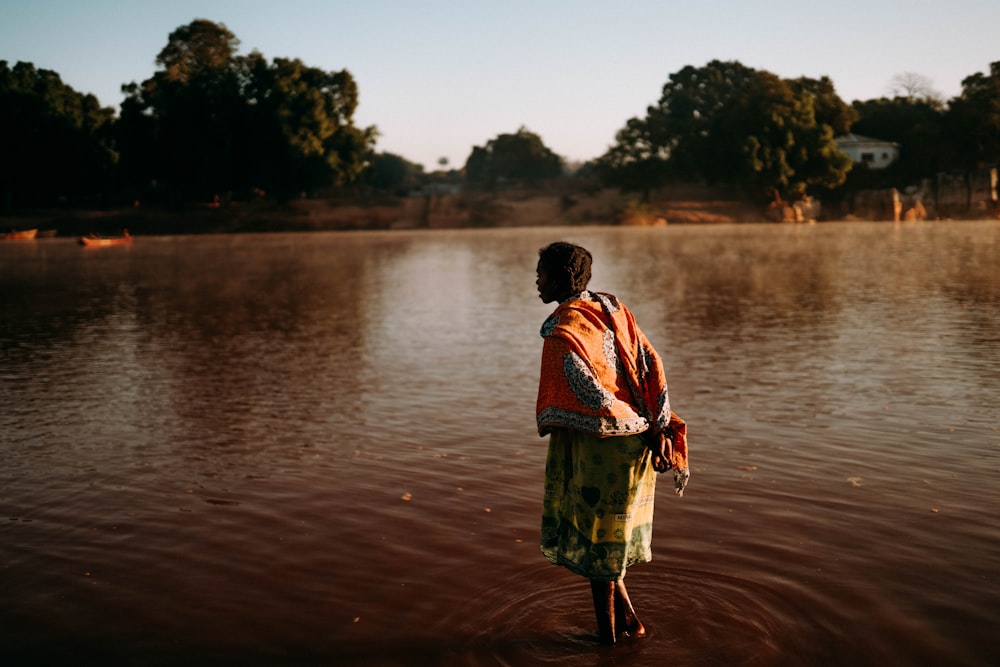 a man standing in a body of water