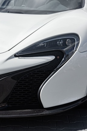 A close-up shot of the Raysky dashcam mounted on a car windshield showing its sleek design.