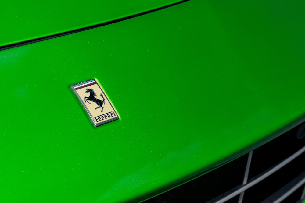 a green car with a logo