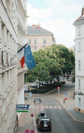 A peaceful street scene in Baccarat with banners supporting social solidarity and inclusion.
