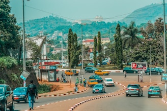 a busy street with cars and people