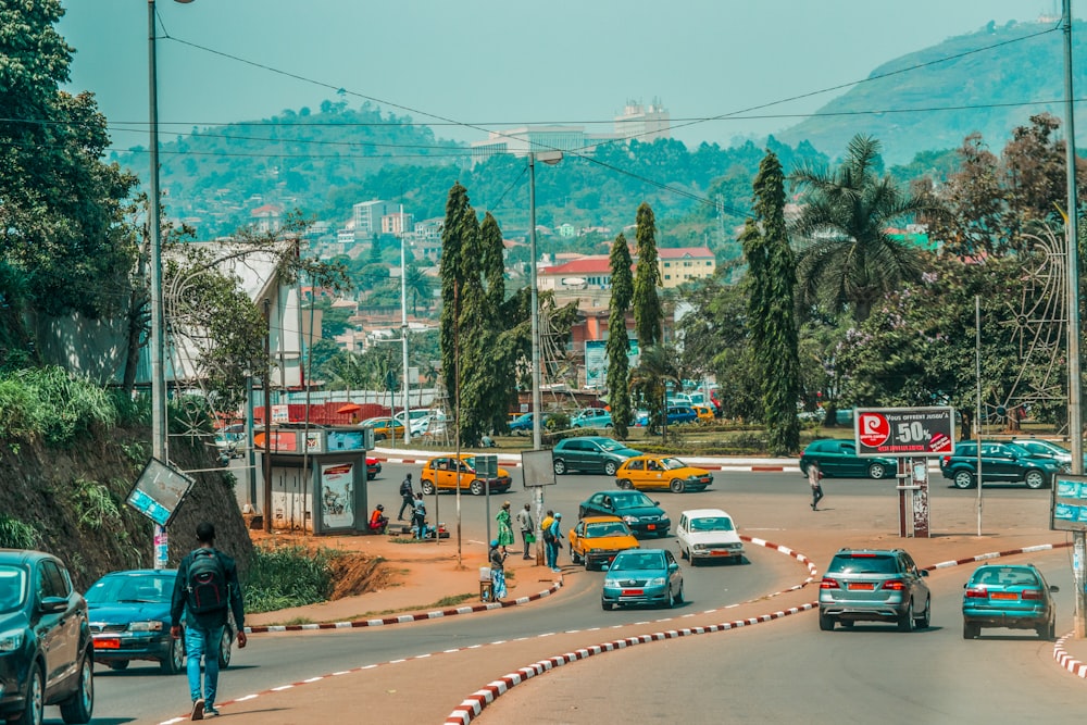 a busy street with cars and people