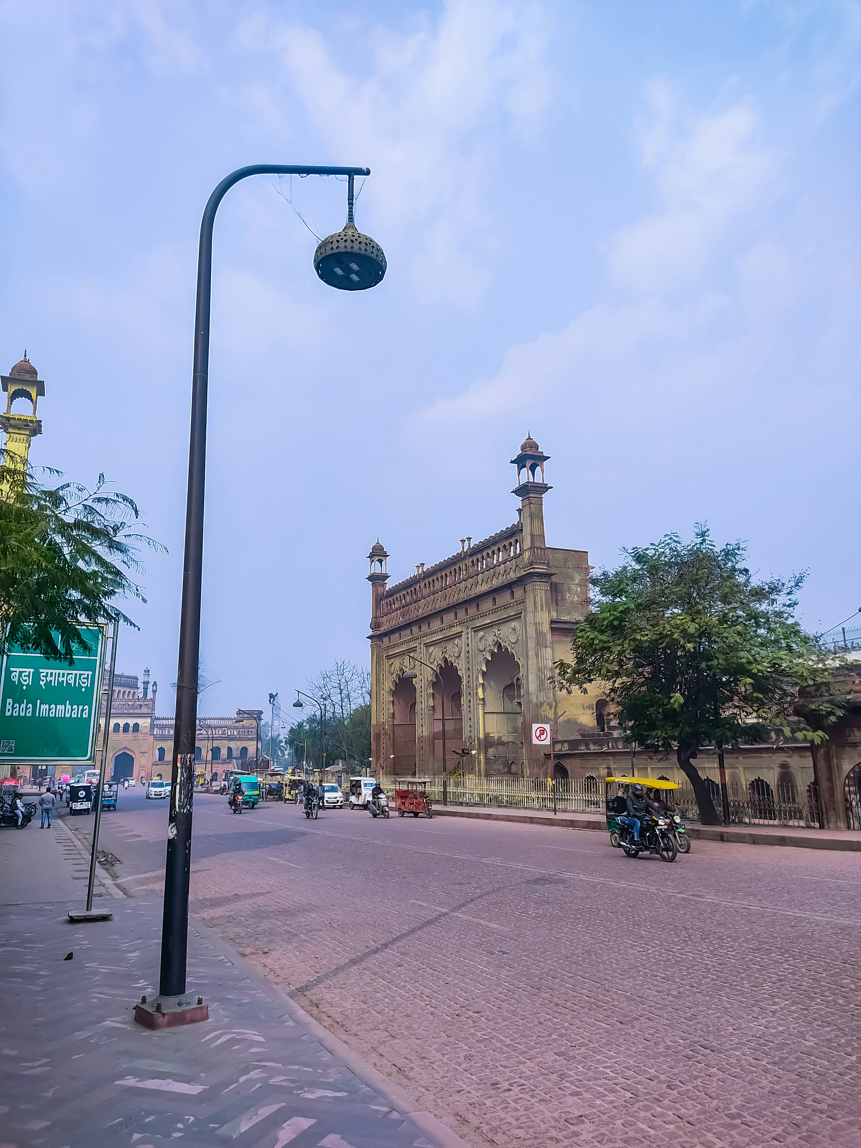 a street with cars and buildings on the side