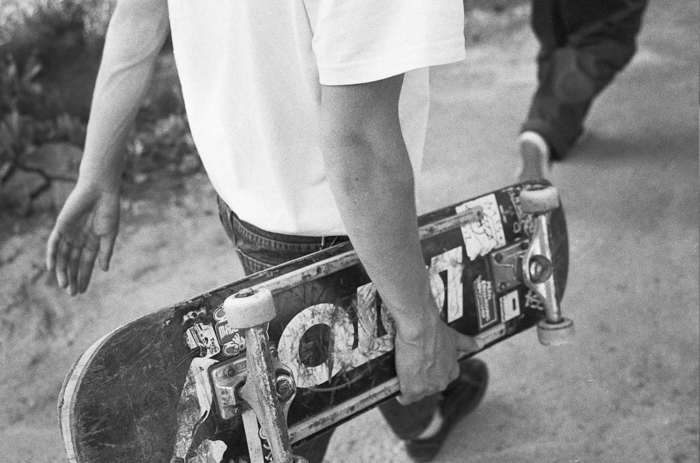 a person holding a skateboard