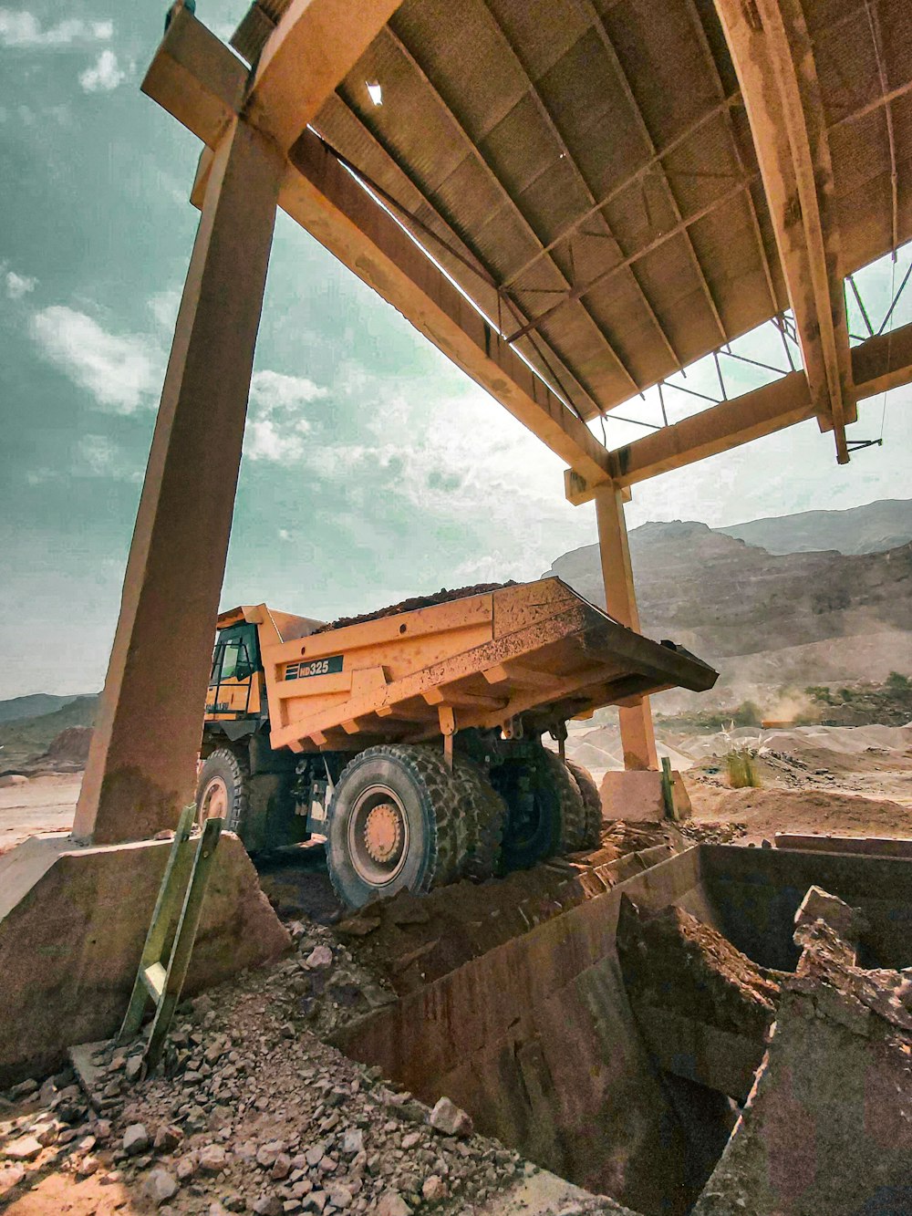 a construction vehicle under a roof