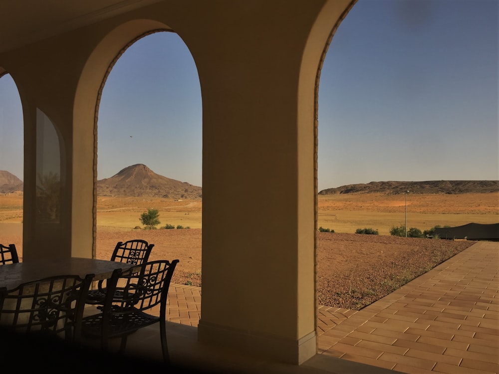 a patio with a table and chairs