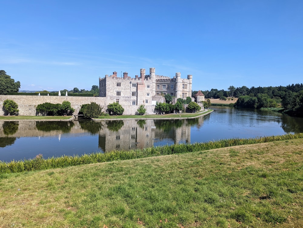 a castle on a hill by Leeds Castle