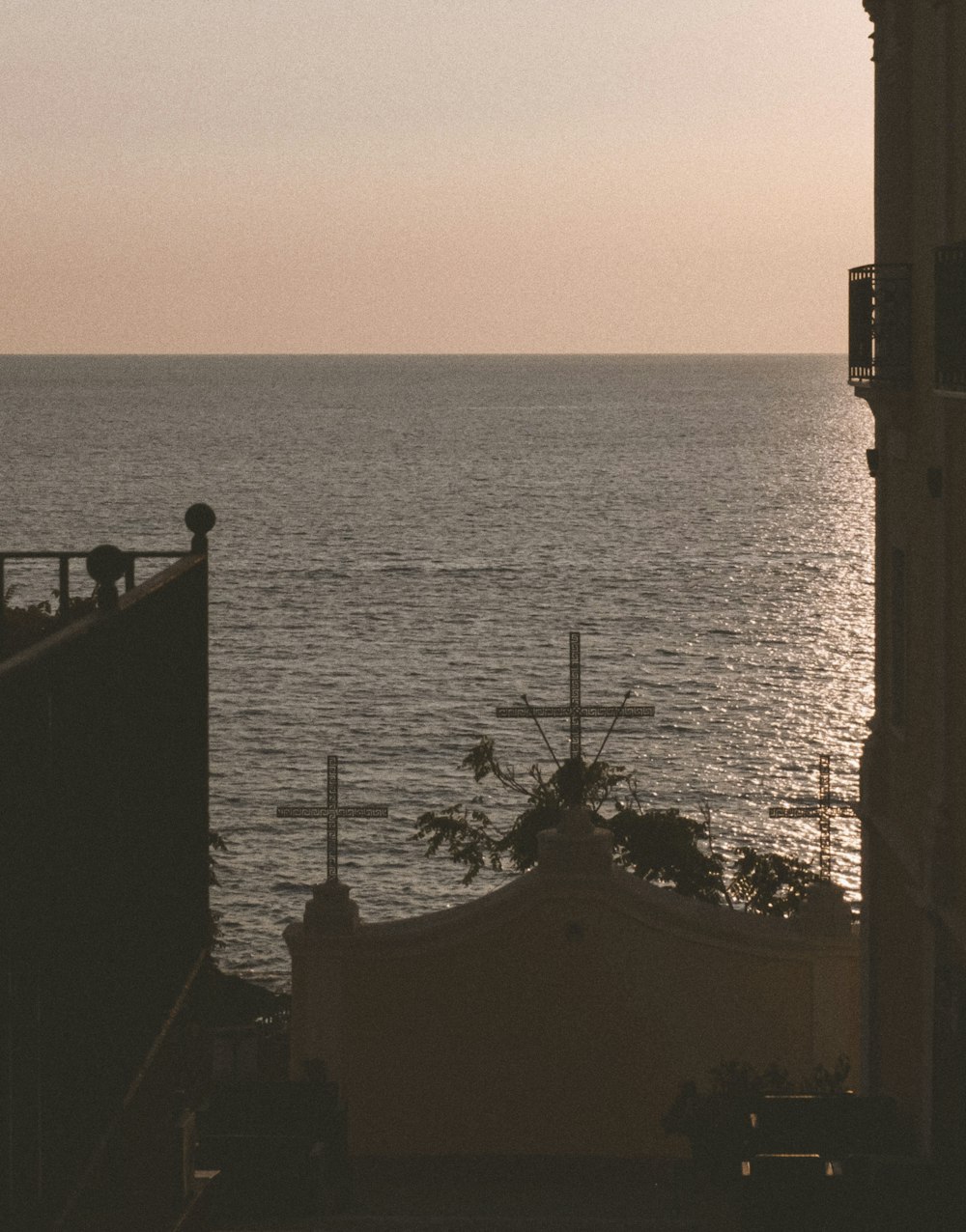 a building with a large body of water in the background