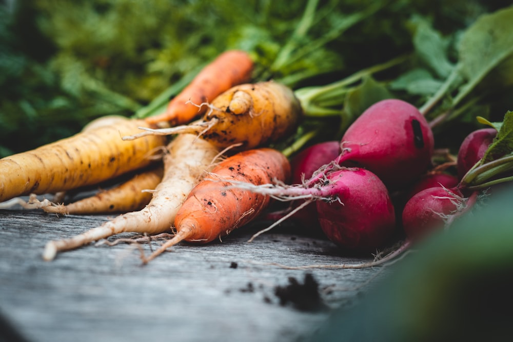 a group of vegetables sit on a table