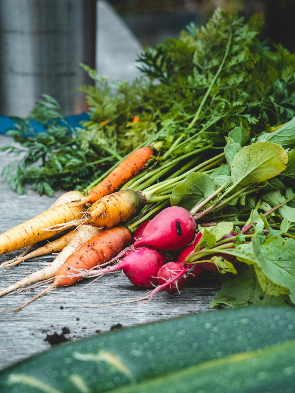 a group of vegetables sit on a table