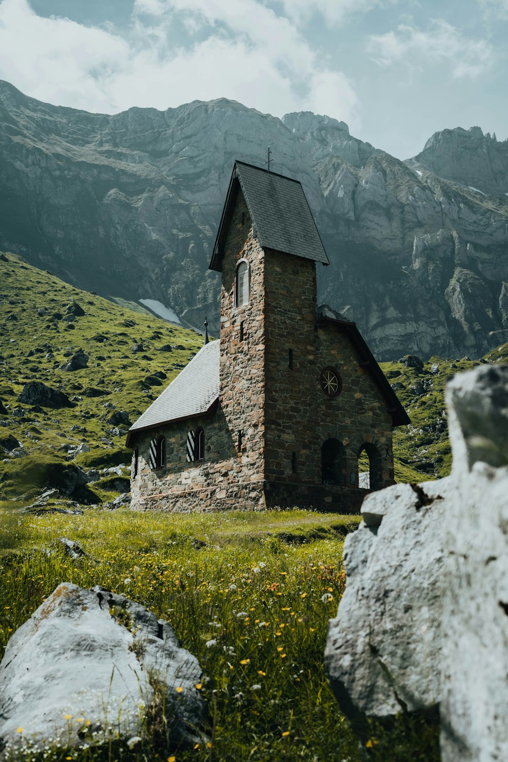 a stone building on a hill