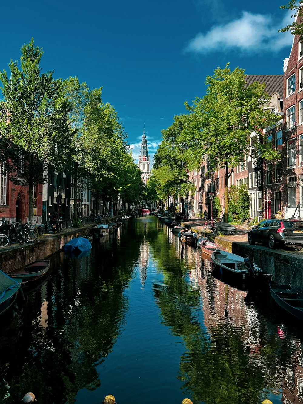 a canal with boats and buildings