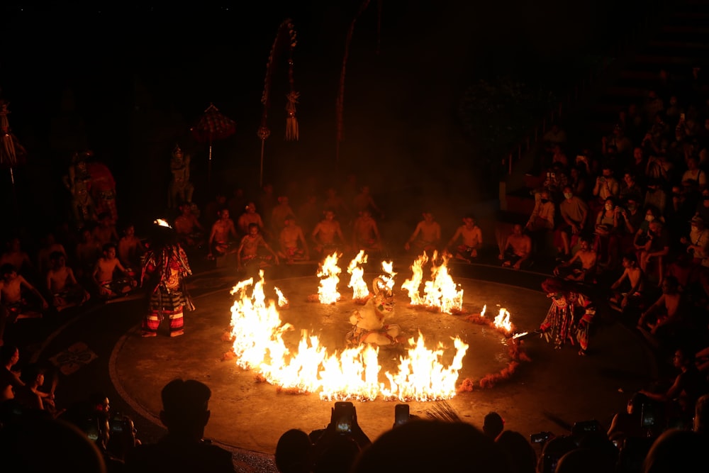 a group of people around a fire