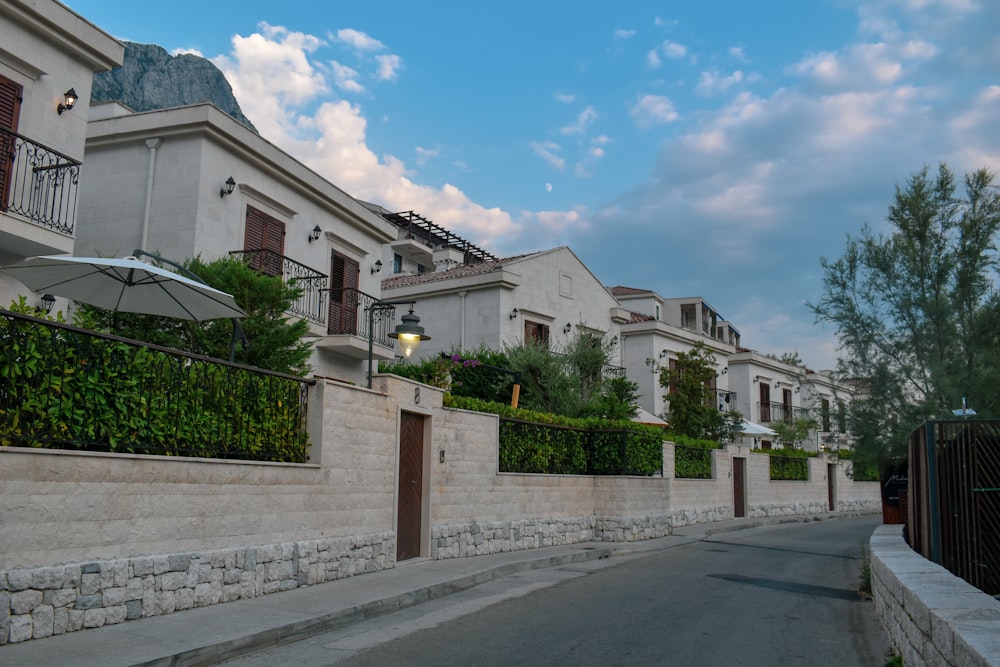 a stone wall with a stone wall and a stone wall with a stone fence and a building with