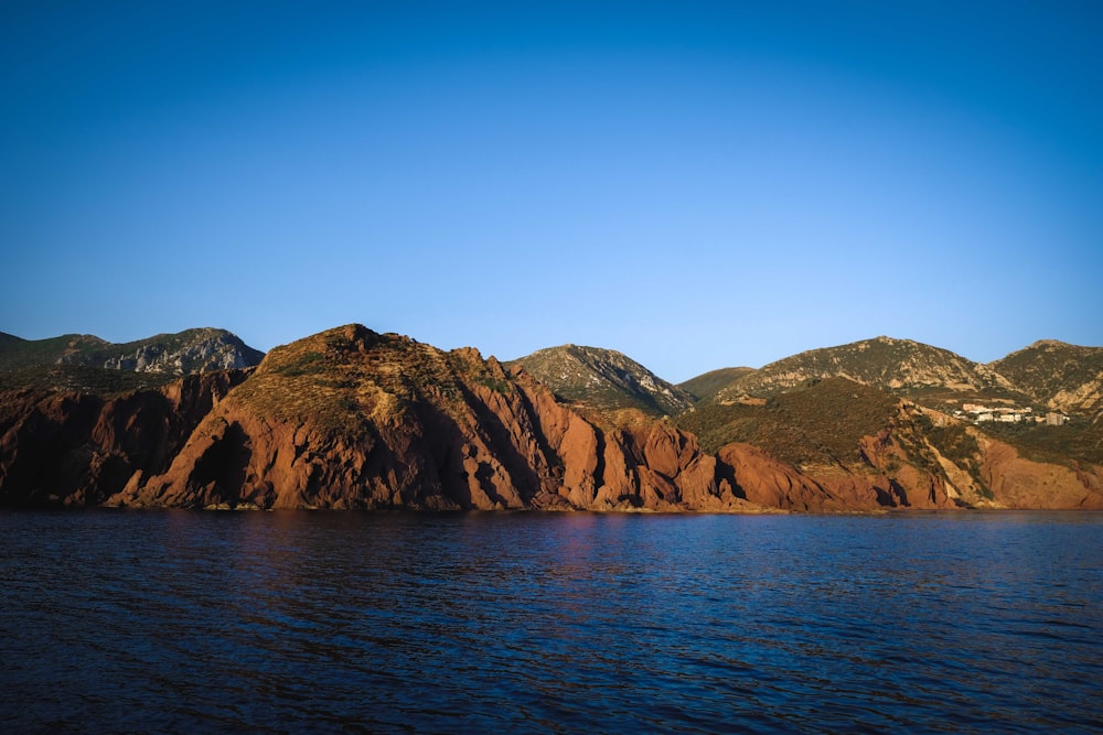 a body of water with a rocky shoreline