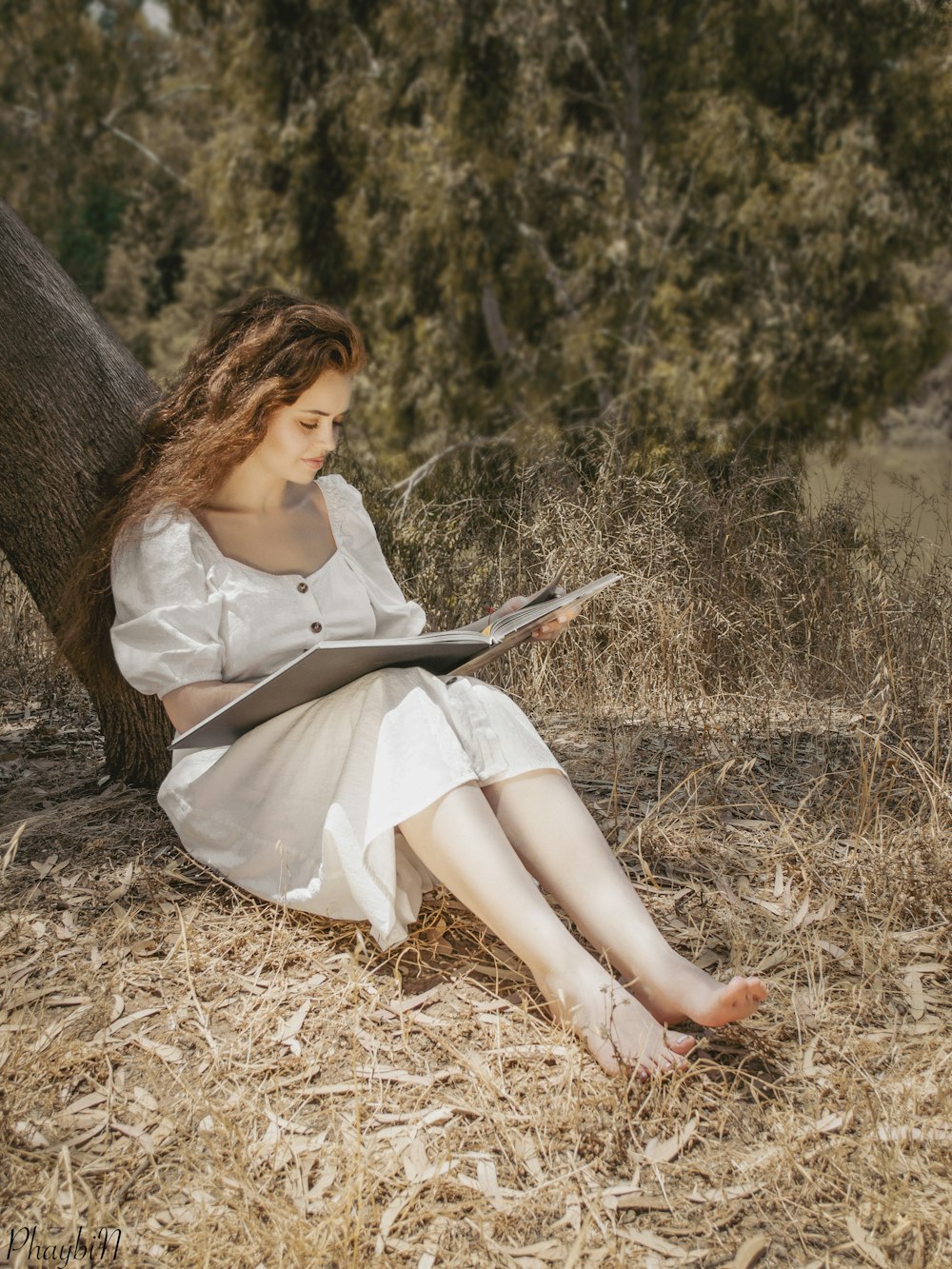 a person sitting in a field