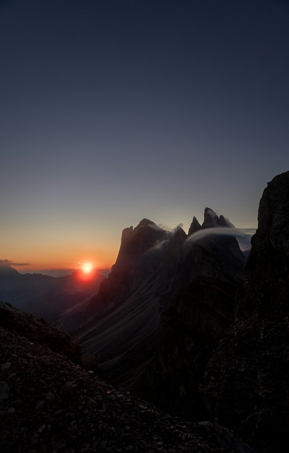 a sunset over a mountain