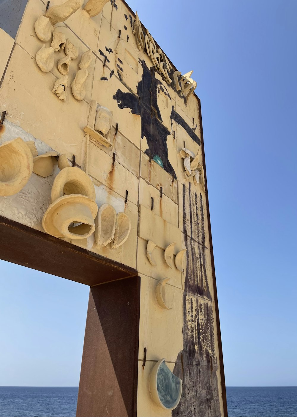 a wooden structure with a statue on top