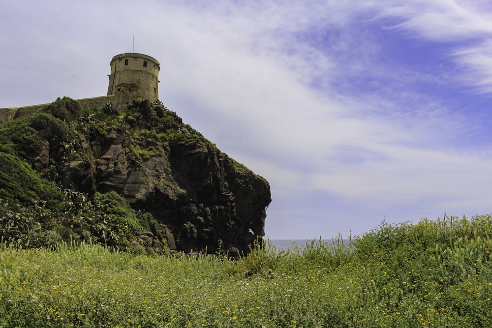 a stone building on a cliff