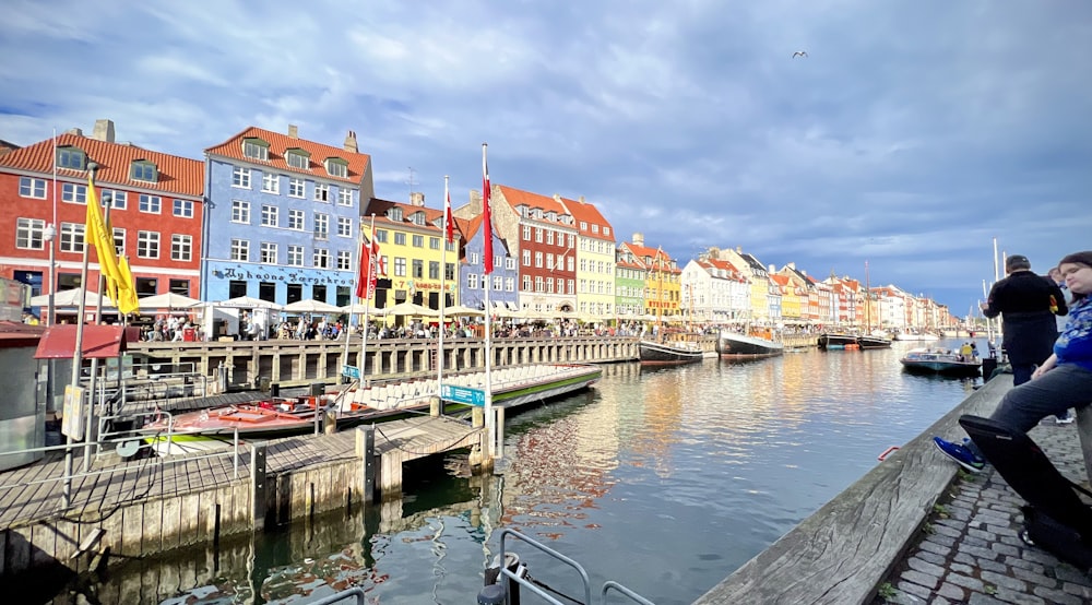 a body of water with buildings along it with Willemstad in the background