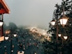 a crowd of people walking on a street