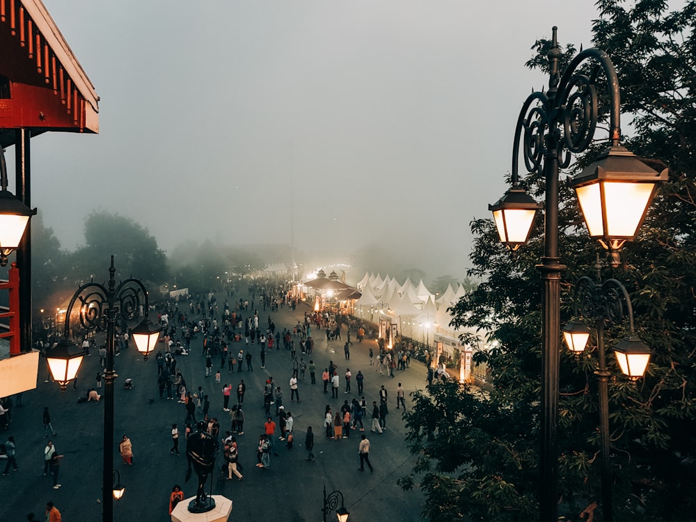 a crowd of people walking on a street