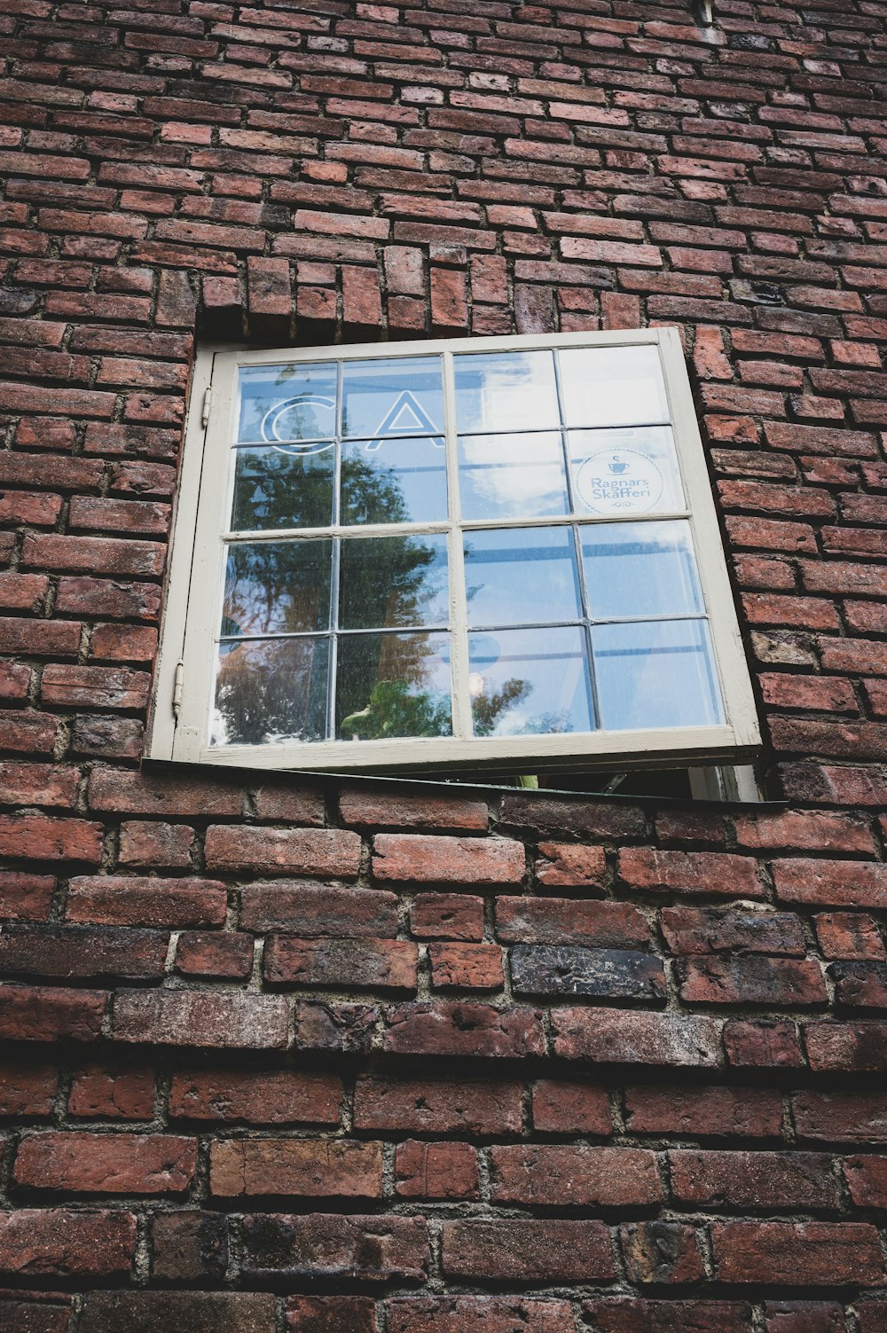 a window on a brick wall