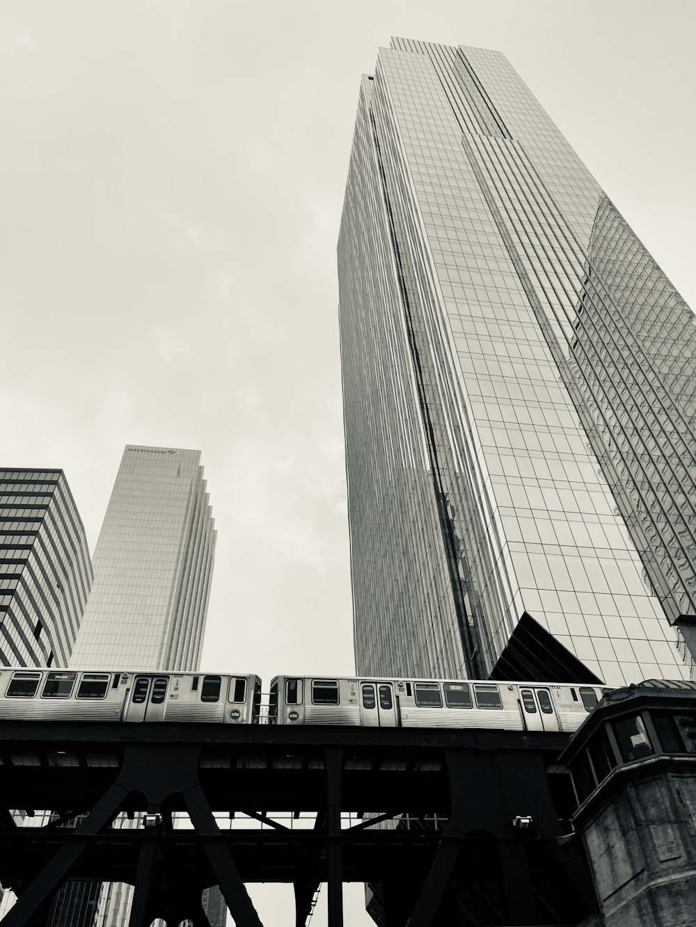 a train going by a skyscraper