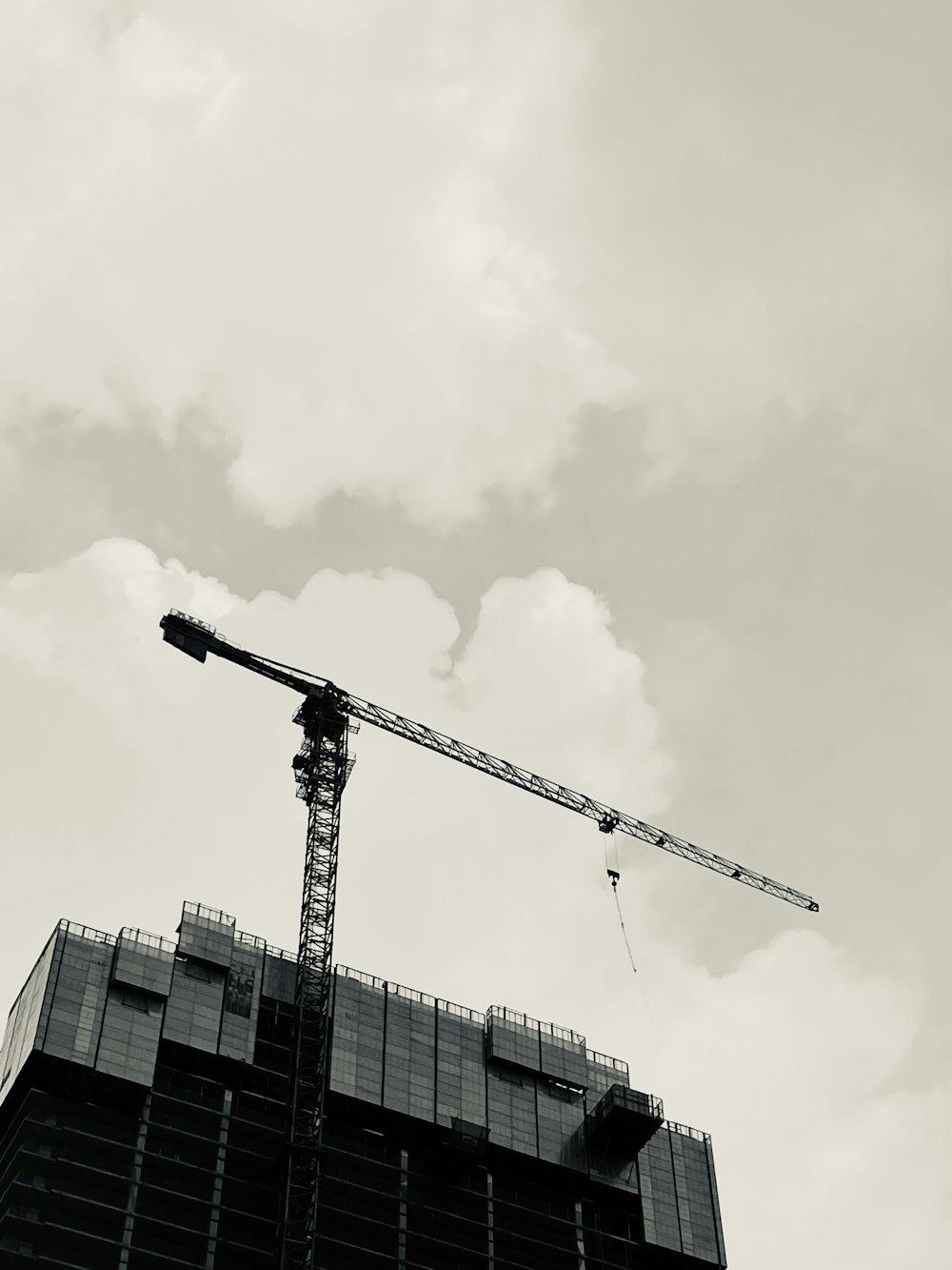 a crane next to a building